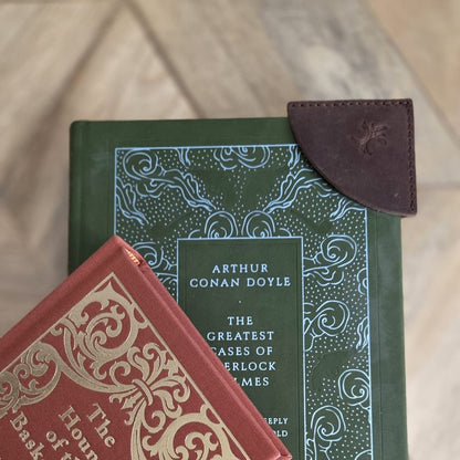 Brown top grain crazy  leather corner bookmark on two hardcover books