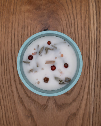 Top view of Path candle decorated with botanicals, berries and mineral stones