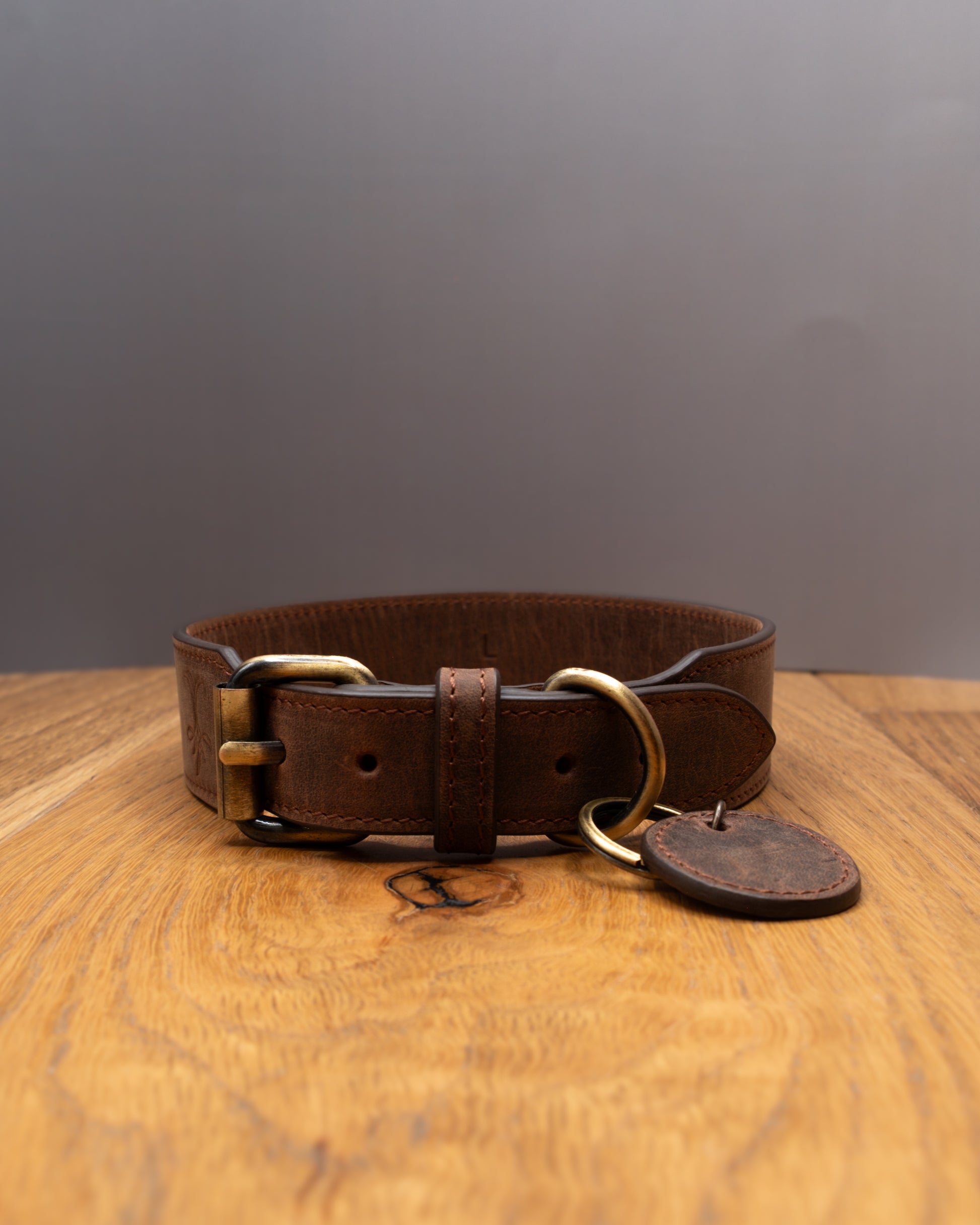 Opposite side view of brown top grain crazy leather Dog Collar with brass hardware and decorative leather charm