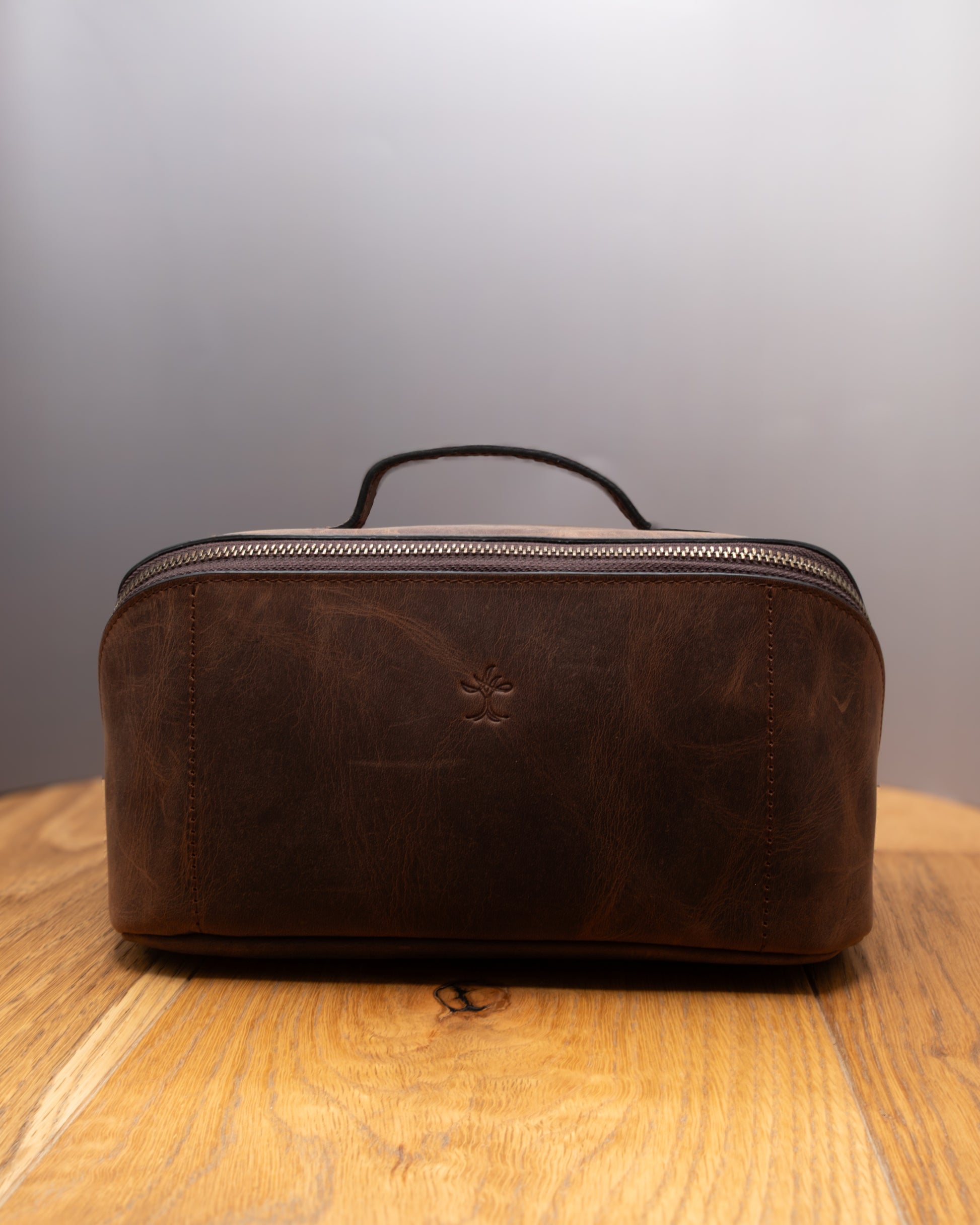 Brown top grain crazy leather Toiletry Bag shown from the front