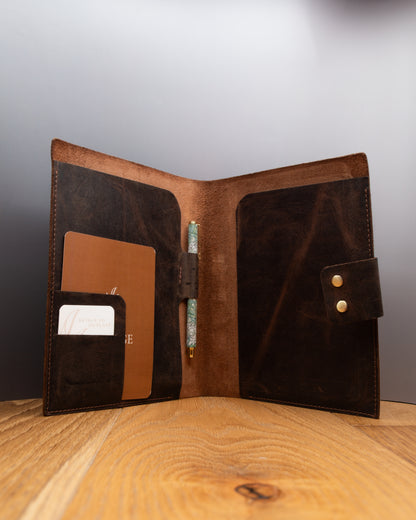Open brown top grain crazy leather Notebook Cover showing interior pockets